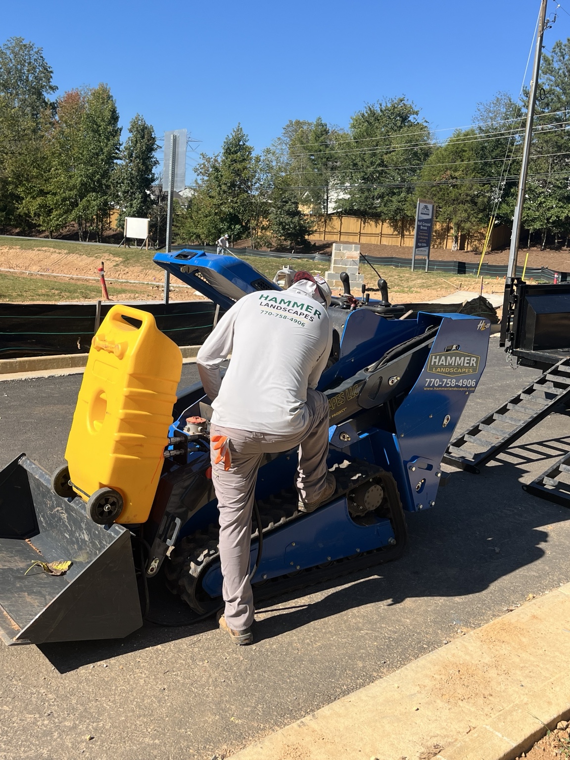 Our crew greasing and preparing equipment as we mobilize on site.