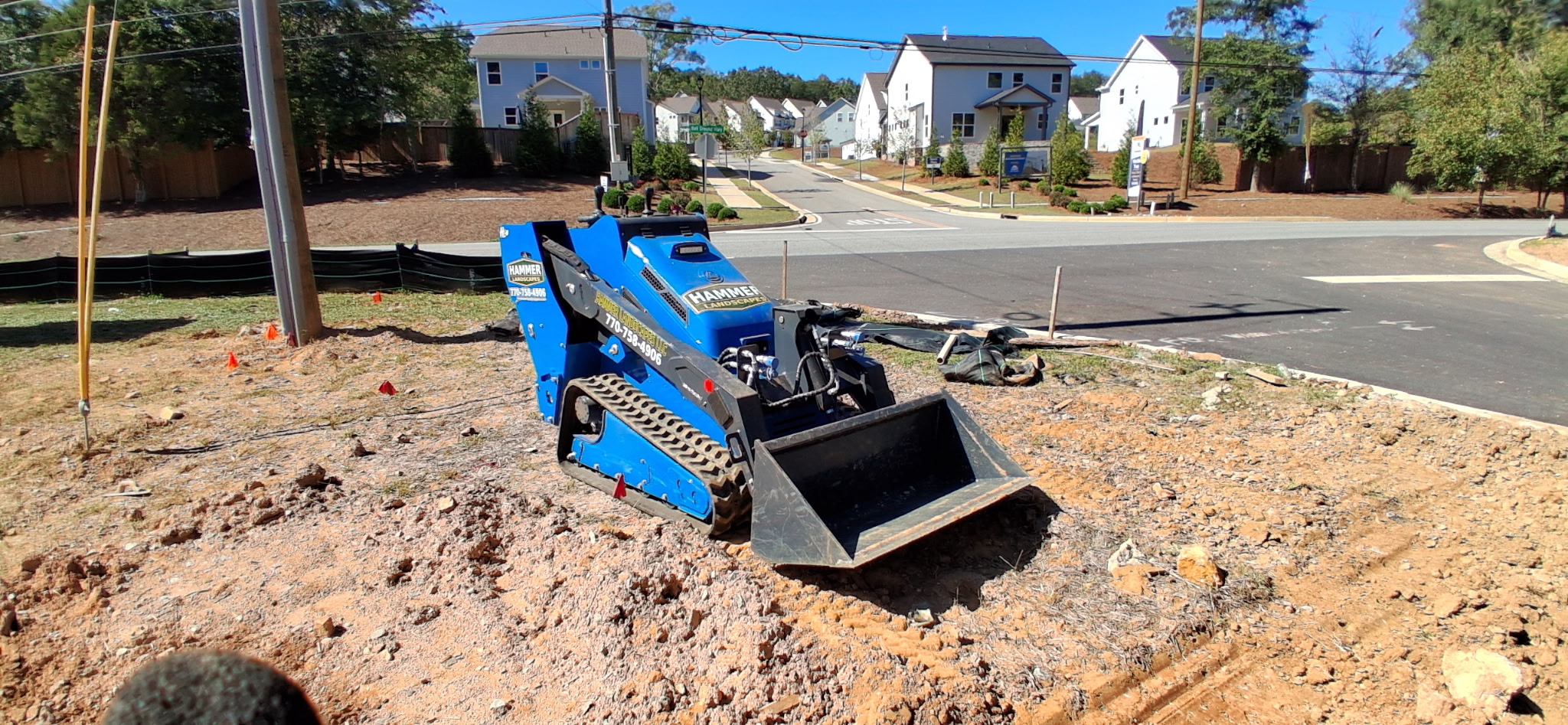 Our branded mini skid ready for grading and landscape installation.